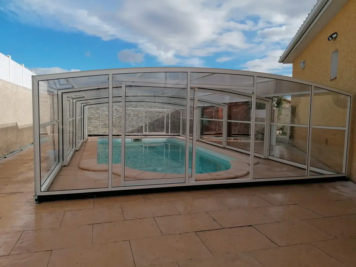 Abri piscine télescopique bas